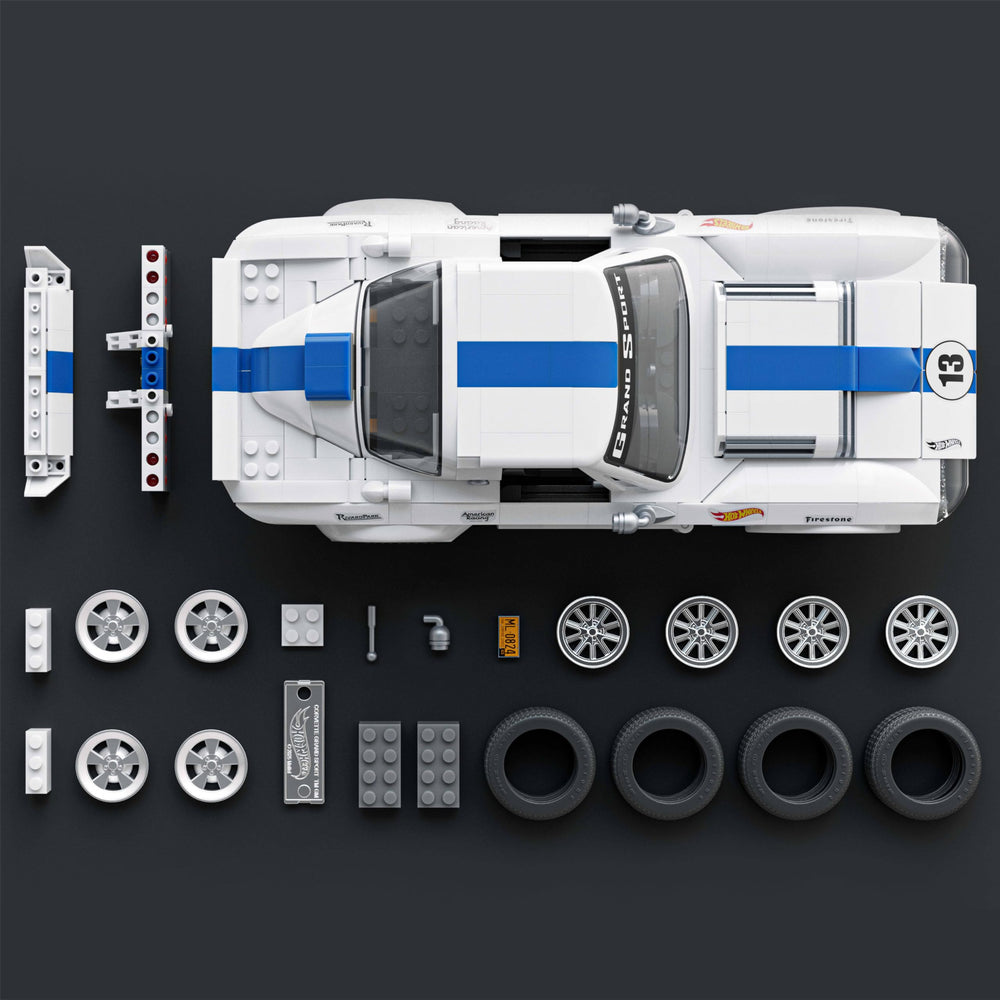Mattel Brick Shop exclusive metal car included for collector display.