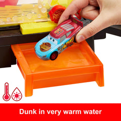 Mattel Cars finish line launch shows Lightning McQueen speeding across the platform.