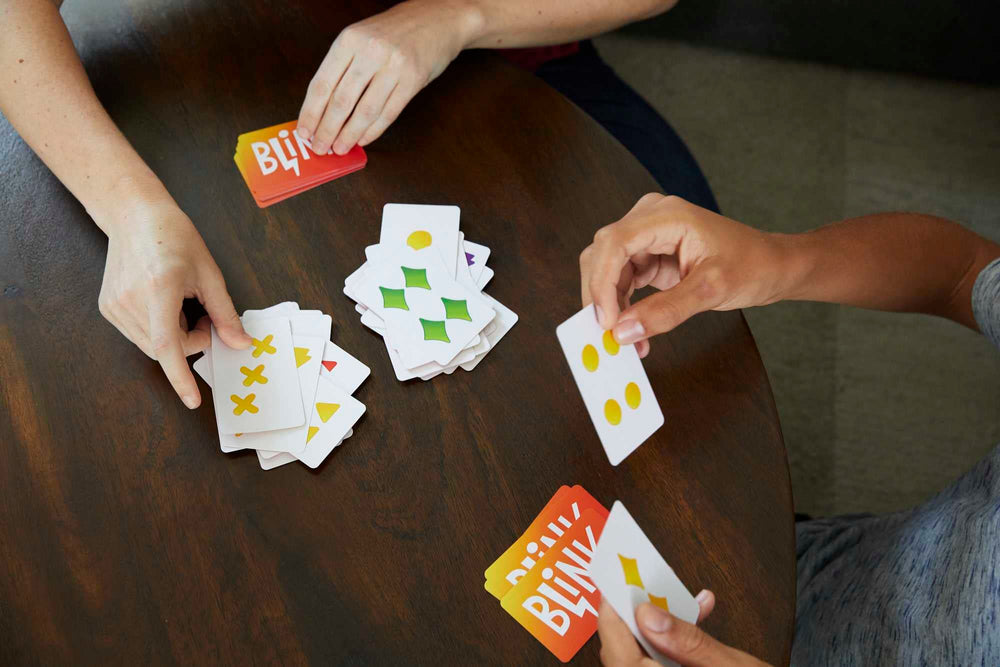 Mattel Games Blink two players race to empty hands for fast rounds.