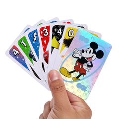 Mattel UNO Disney 100 play-action shots illustrate family game time