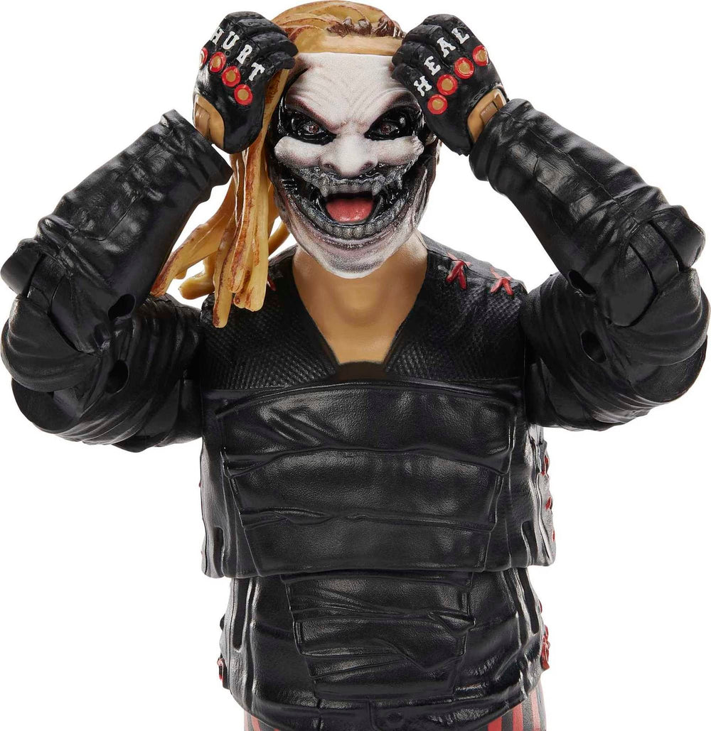 Mattel WWE Ultimate Edition Bray Wyatt figure showing swappable heads for varied expressions