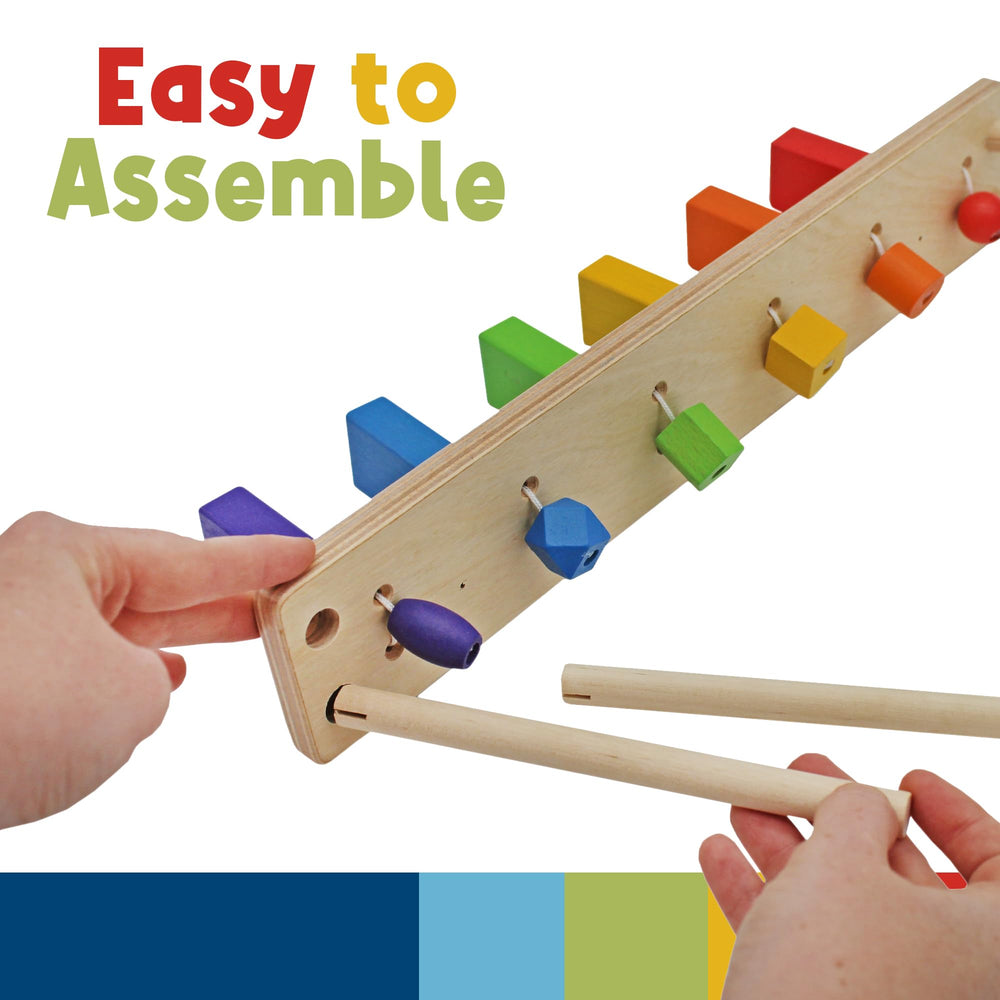 Domino reset action showing kid engaging with colors and shapes.