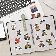 Meet Holiday Walle sticker set on a scrapbook for creative accents