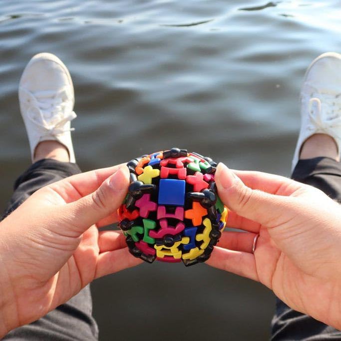 Meffert's Gear Ball with six colored gears, a vibrant visual challenge.
