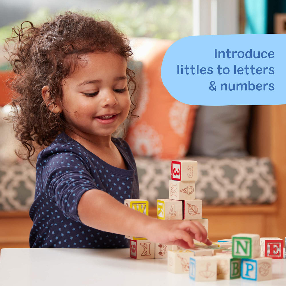 Melissa & Doug blocks stacked in play show alphabet and number recognition.