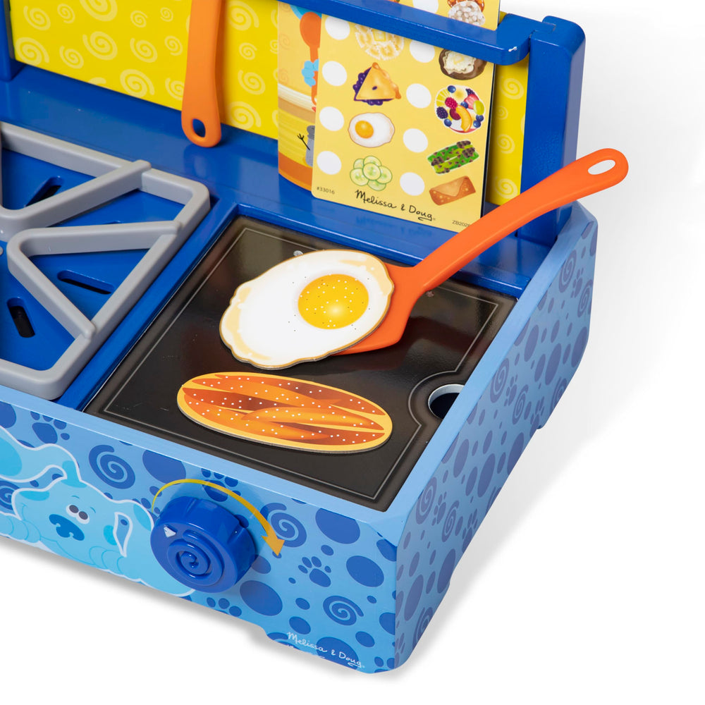 Knobs that click and turn on Blue's Clues & You wooden stovetop