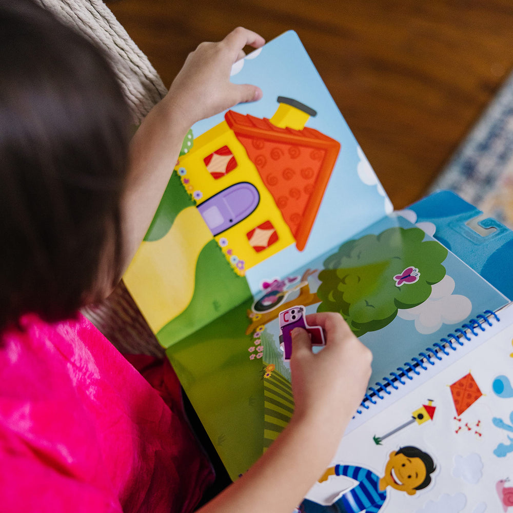 Melissa & Doug restickable stickers store neatly in the spiral-bound pad for easy cleanup