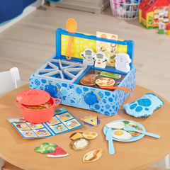 Utensils and paw-shaped oven mitt included in the set for pretend serving