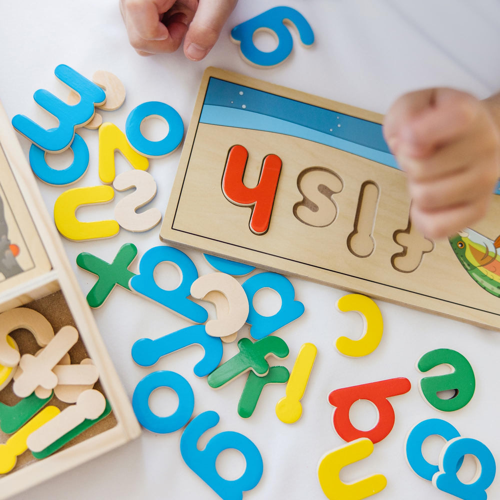 Melissa & Doug See & Spell boards pair illustrations with letters to prompt word creation.