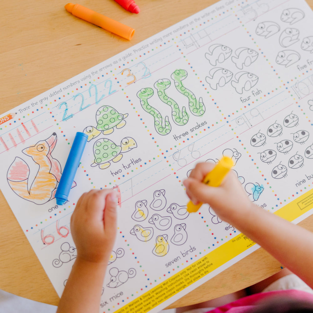 Crayons slide up and down in protective holders for tidy storage.