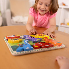 Puzzle promotes eye-hand coordination with Melissa & Doug dinosaur pieces