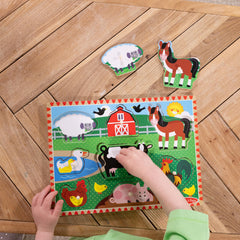 Melissa & Doug easy-grasp pegs support hand strength during puzzle play.