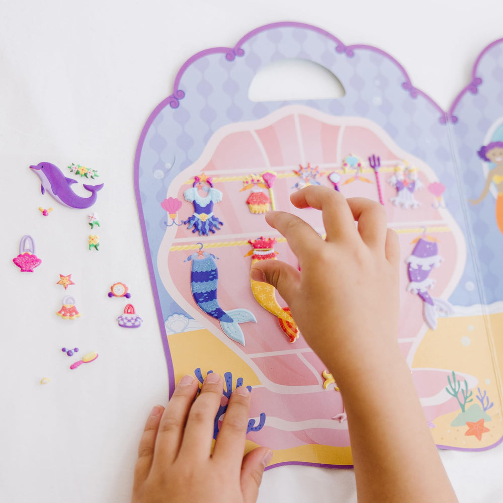 Melissa & Doug fold-out background board keeps play neat and portable.