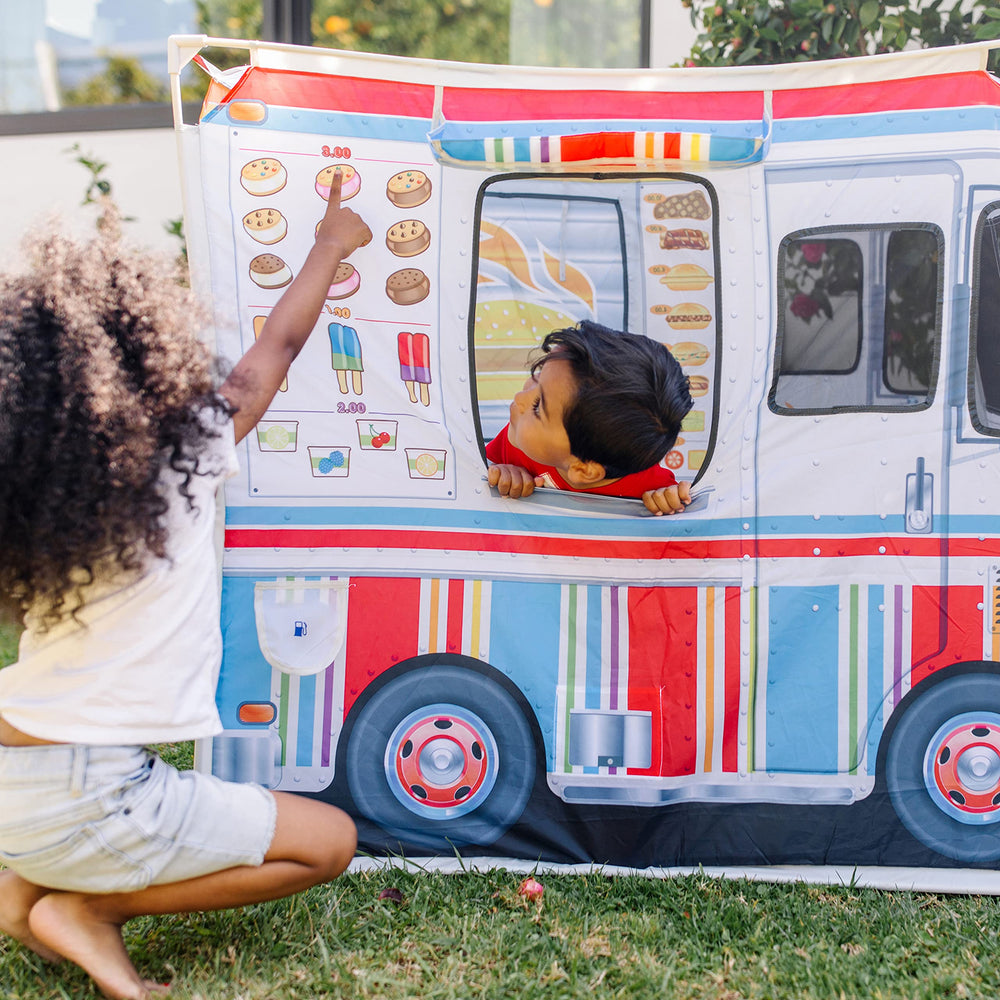 Melissa & Doug mesh front window lets kids peek outside during street-side service imagination.