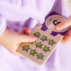 Independent play with Melissa & Doug number puzzles to build confidence