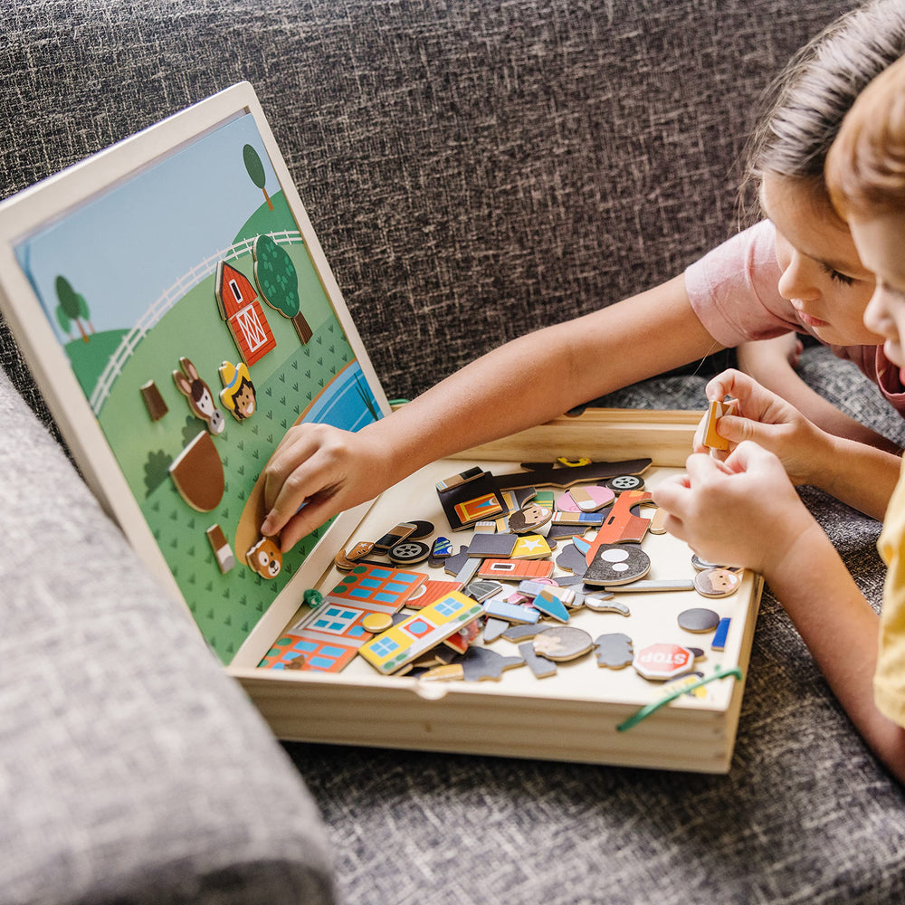 Melissa & Doug kids playing with magnets for learning and fun.