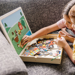 Melissa & Doug kids playing with magnets for learning and fun.