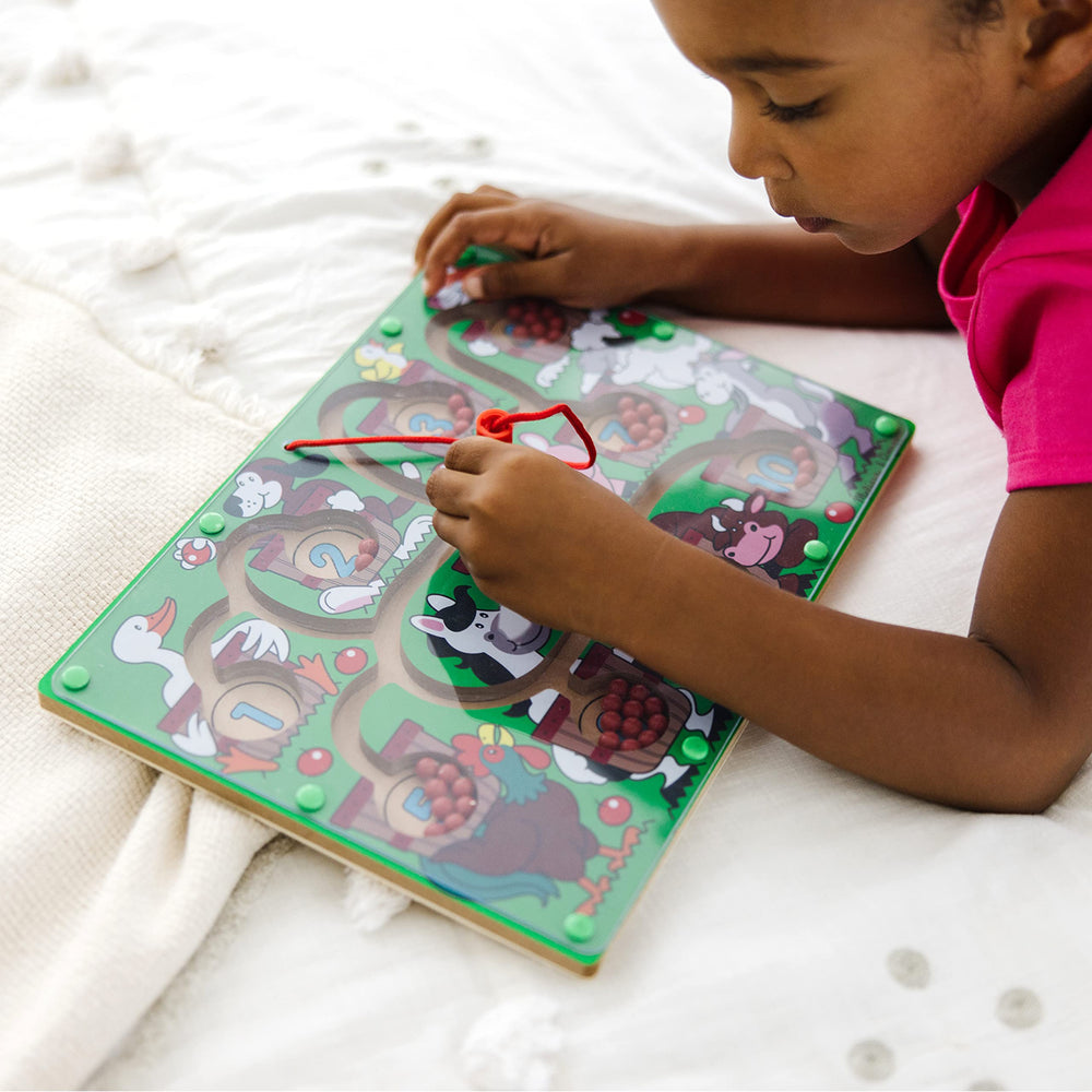 Melissa and Doug Magnetic Wand Number Maze enhances hand-eye coordination through active play.