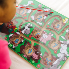 Melissa and Doug Magnetic Wand Number Maze travel-friendly wooden puzzle for on-the-go learning.