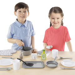 Melissa & Doug olive oil bottle and towel for realistic kitchen role play.