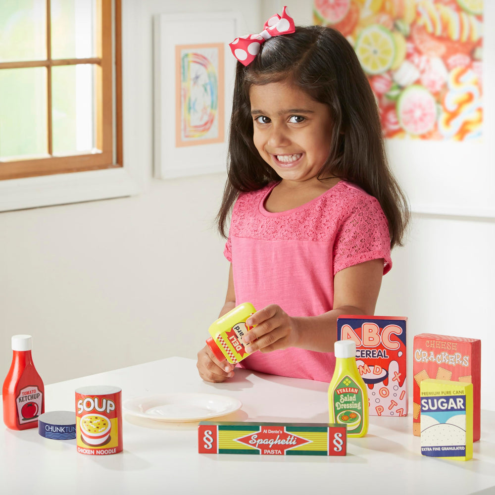 Melissa & Doug wooden ketchup toy for creative meal-time pretend play.
