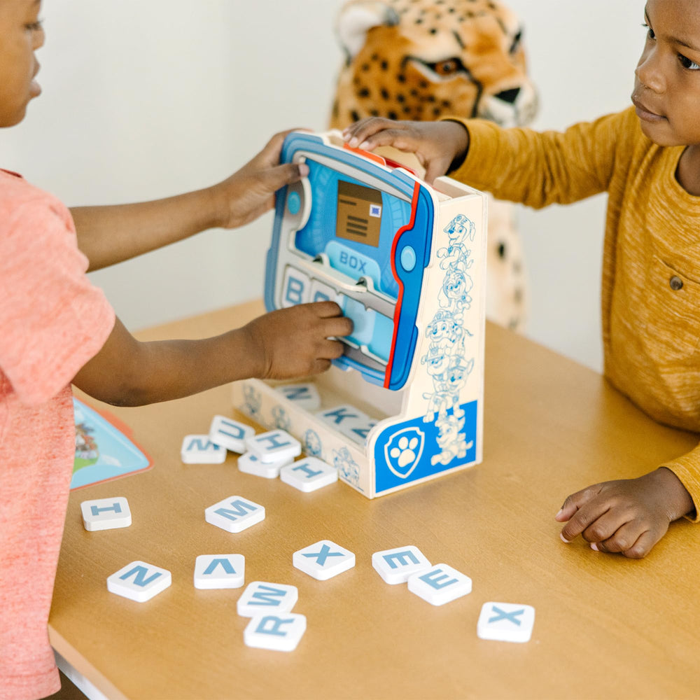 Kids engage in a PAW Patrol spelling session boosting focus and cooperation.