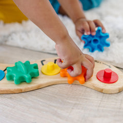 Wooden base close-up showing sturdy construction and painted caterpillar feet