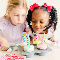 Cupcake tops are wipe-off for reusable decorating with icing markers.