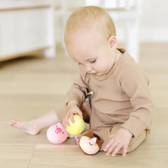 Melissa & Doug Rollables Farm Friends pig ready for squeezes and grasping.
