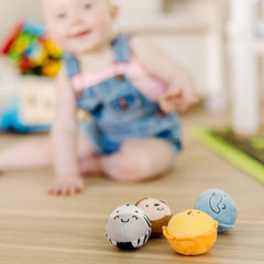 Demo of Melissa & Doug Rollables in play; kids roll to learn cause-and-effect.