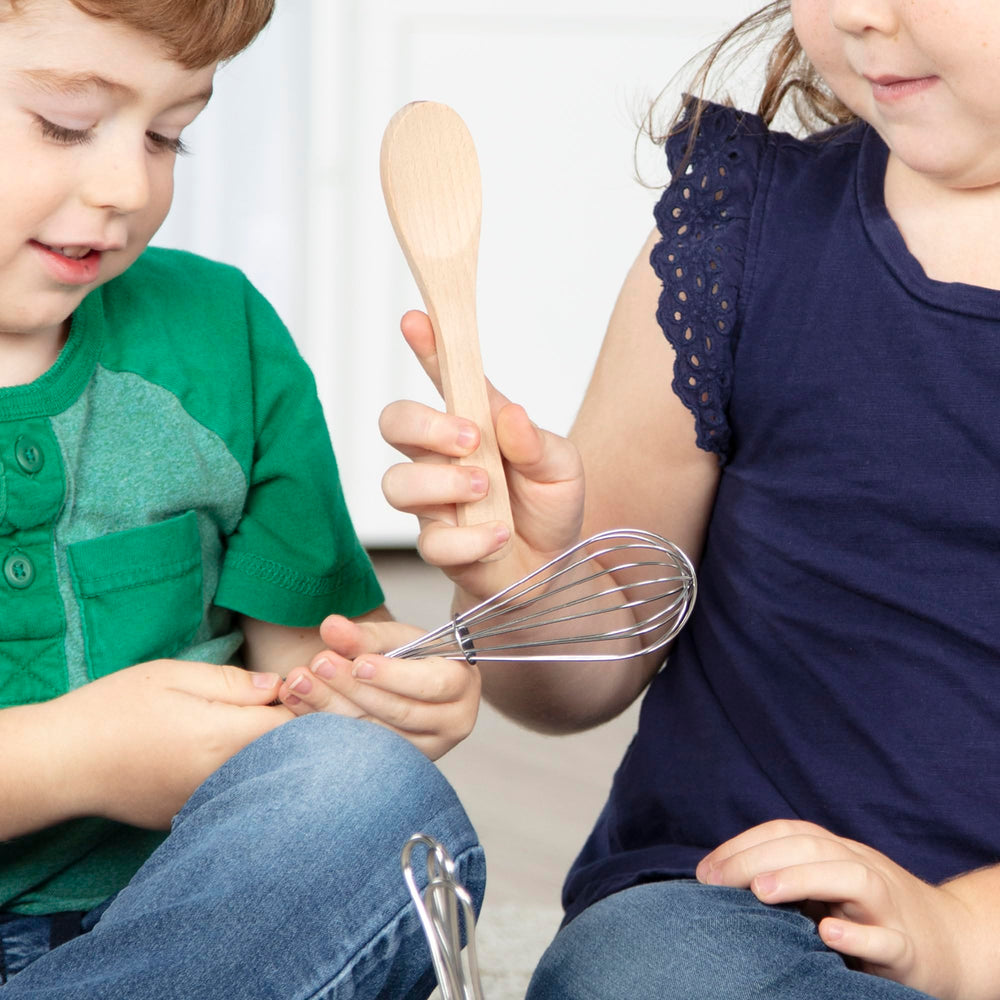 Melissa & Doug Stir & Serve metal holder keeps utensils organized and accessible.