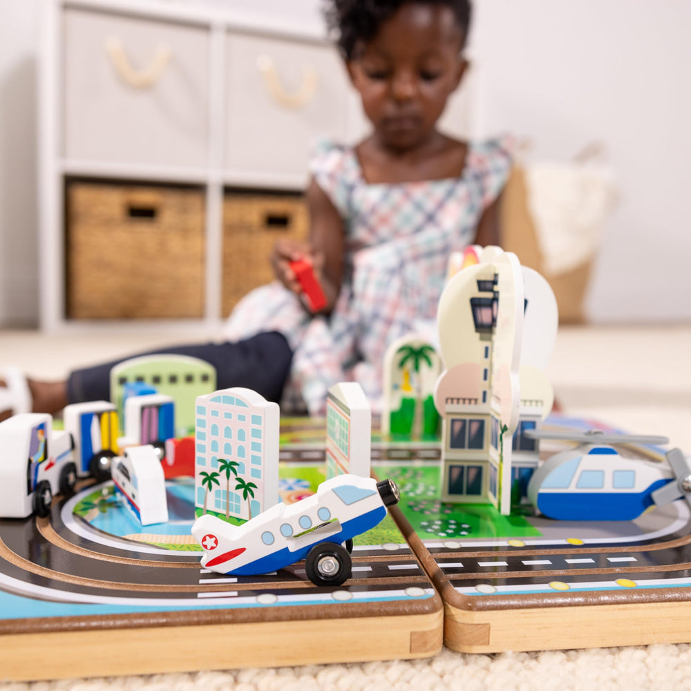 Melissa & Doug wooden helicopter adds aerial role-play to the airport scene.