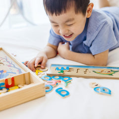 Melissa & Doug See & Spell wooden letter tiles fit into eight boards.