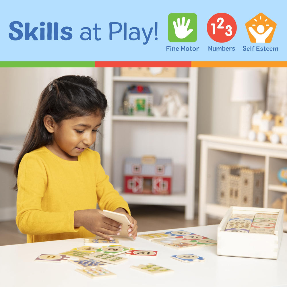 Wooden pieces organized and ready for storage in Melissa & Doug box