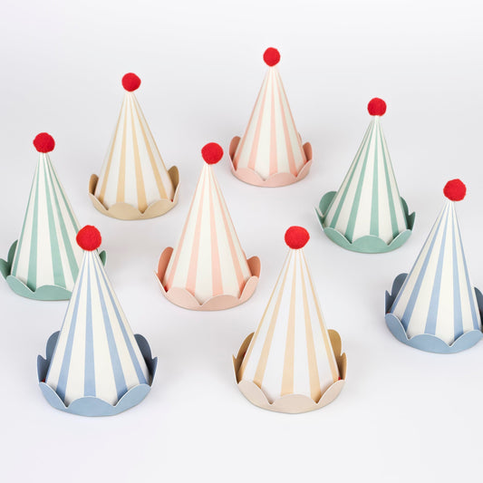 Meri Meri birthday hats with eight colorful cone designs, ideal for festive photos.