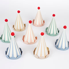 Meri Meri birthday hats with eight colorful cone designs, ideal for festive photos.
