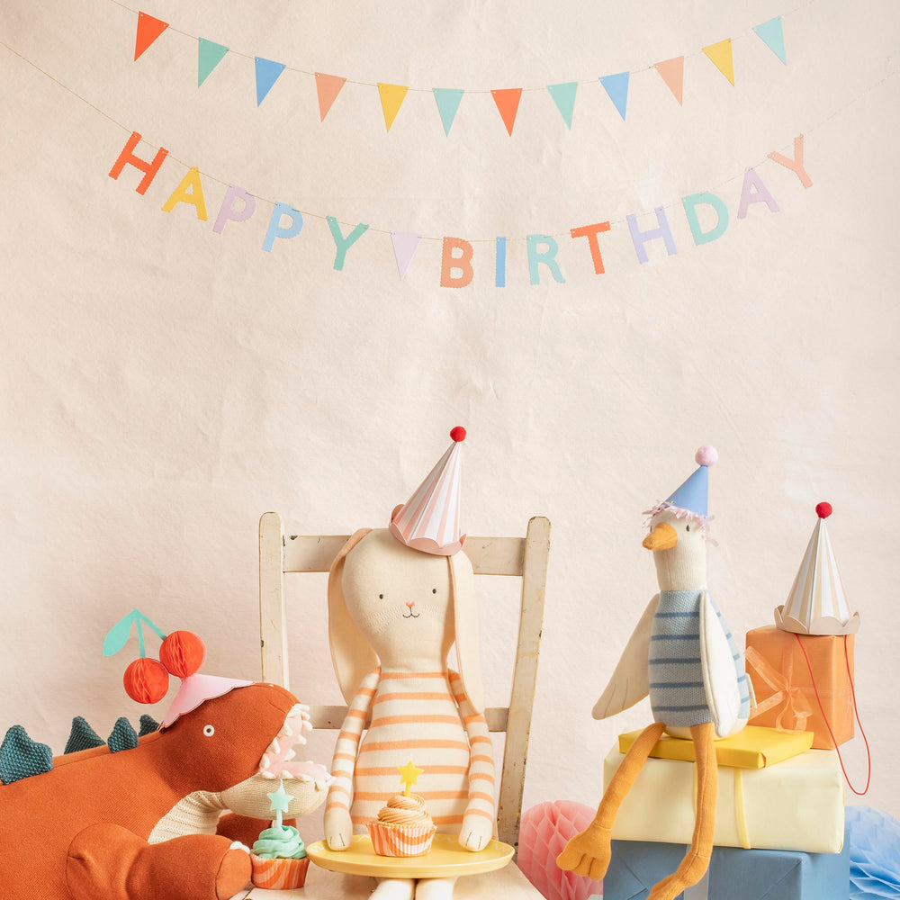 Meri Meri red pompoms with scalloped edges enhance party styling in photos.