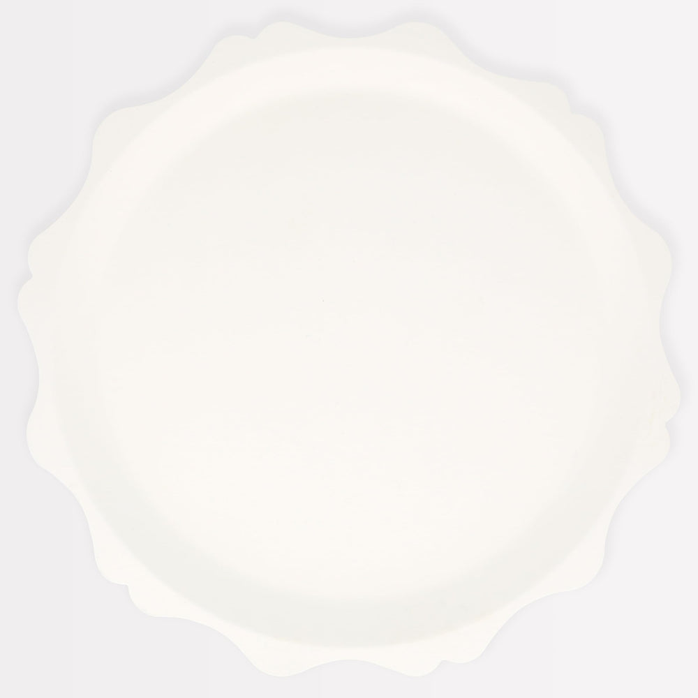 Meri Meri decorative-edge cream plates elevating party tables with sustainable design.