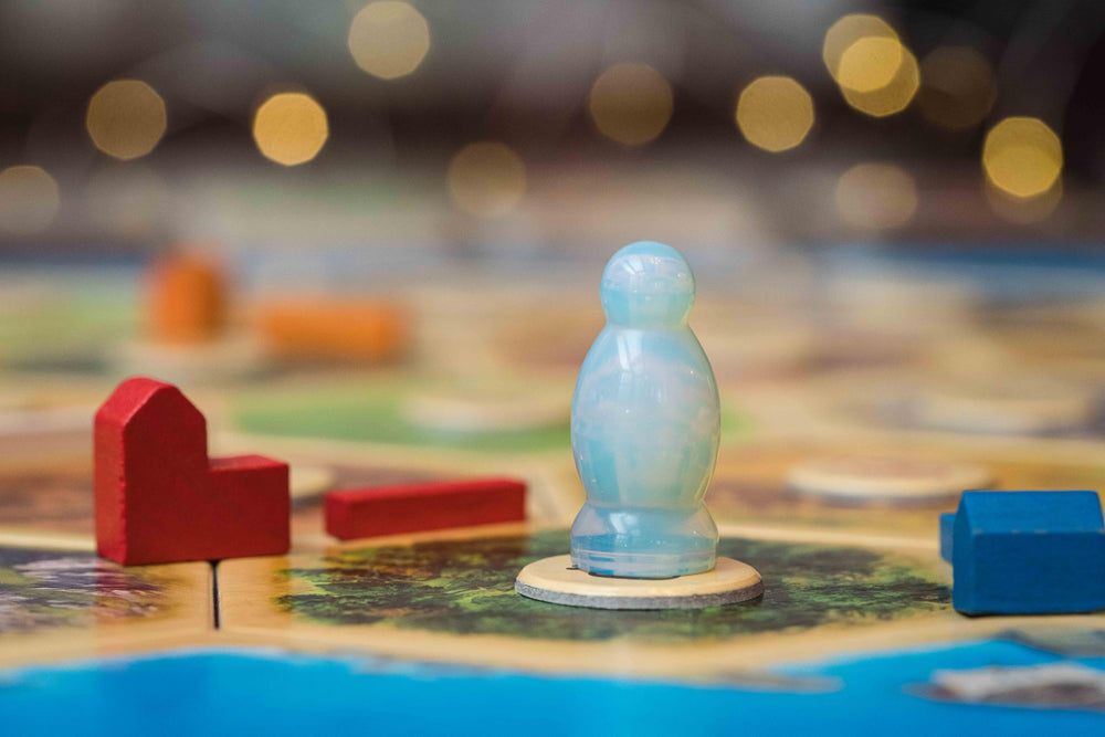 FanRoll CATAN night setup with metal dice and opalite robber
