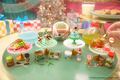 MGA's Miniverse Make It Mini Holiday resin pieces curing under sun