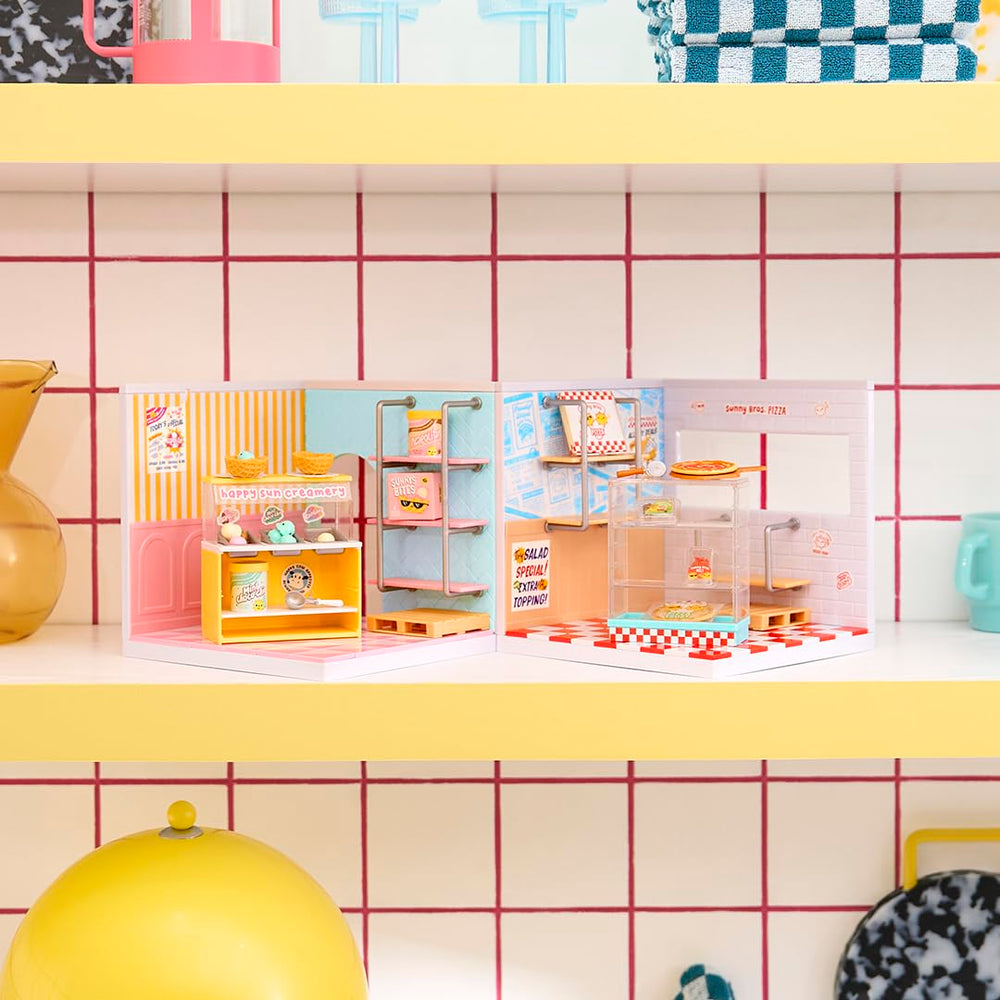 MGA's Miniverse Pizza Shop pack unbox for playful storefront dioramas.
