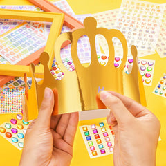 MGZTTHW kids decorating crowns with colorful stickers during a joyful party.