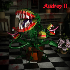 Three Audrey II mini plants add texture to a horror-themed setup