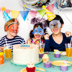 Minatee kids wearing sea animal masks for fun photo moments.