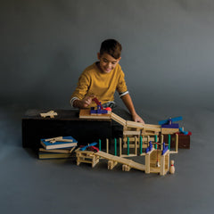 MindWare KEVA ball-run structure showing marble motion on planks.