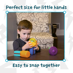 MindWare Start-Up Circuits child assembling blocks encourages fine motor practice.