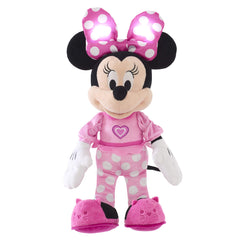 MINNIE Mouse pink pajamas close-up shows soft cuddly fabric for cozy play.