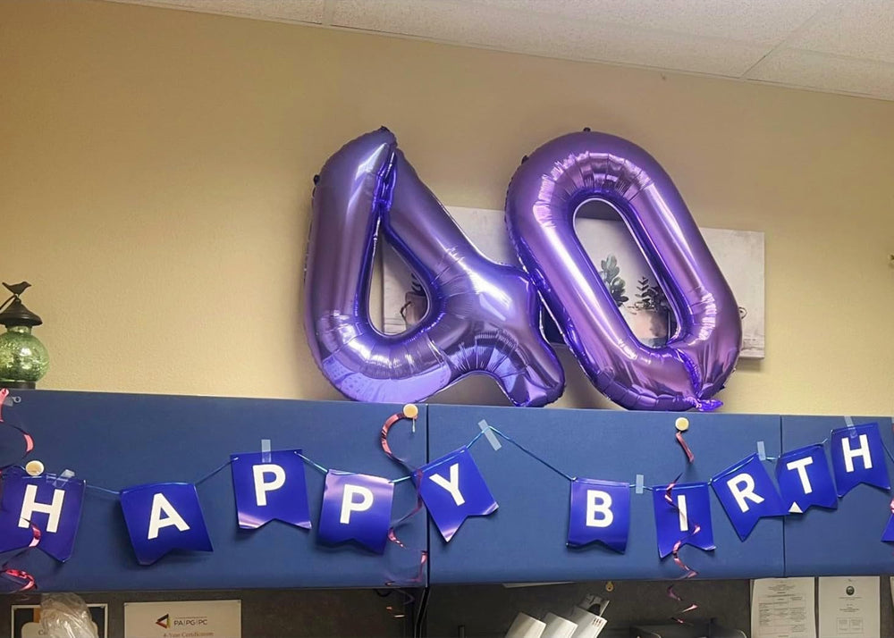 Mluchee 40-inch number balloon 4 purple used as bold wall or door decor.