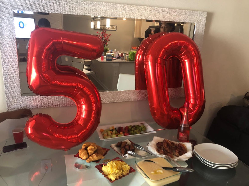 Mluchee 40-inch number balloon 50 serves as a striking party centerpiece and prop.
