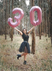Mluchee 40-inch pink number balloon laid on floor for display.